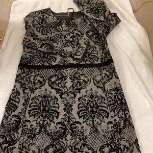 Black and gray 3/4 sleeve dress with green zipper